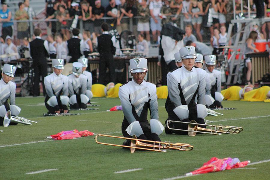 Sophomore Cameron Clark prepares for the Friday night football performance of The Joy of Life