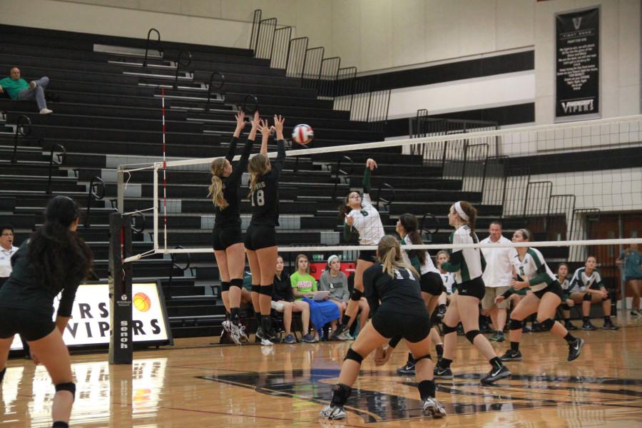 Bryn Recker and Emily McShane blocking ball at Volleypalooza tournament