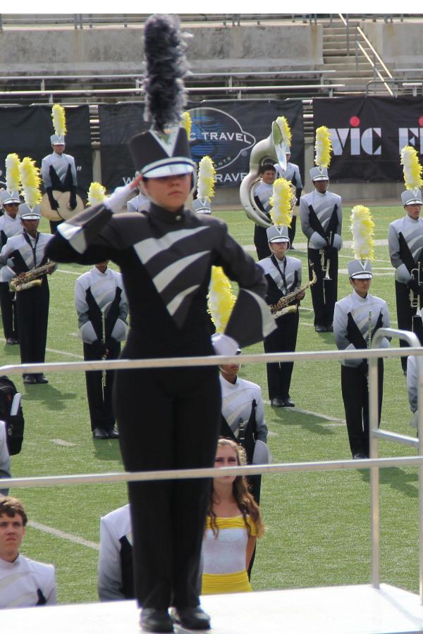 Head Drum Major Olivia Schmitz salutes the judges before the show begins. 