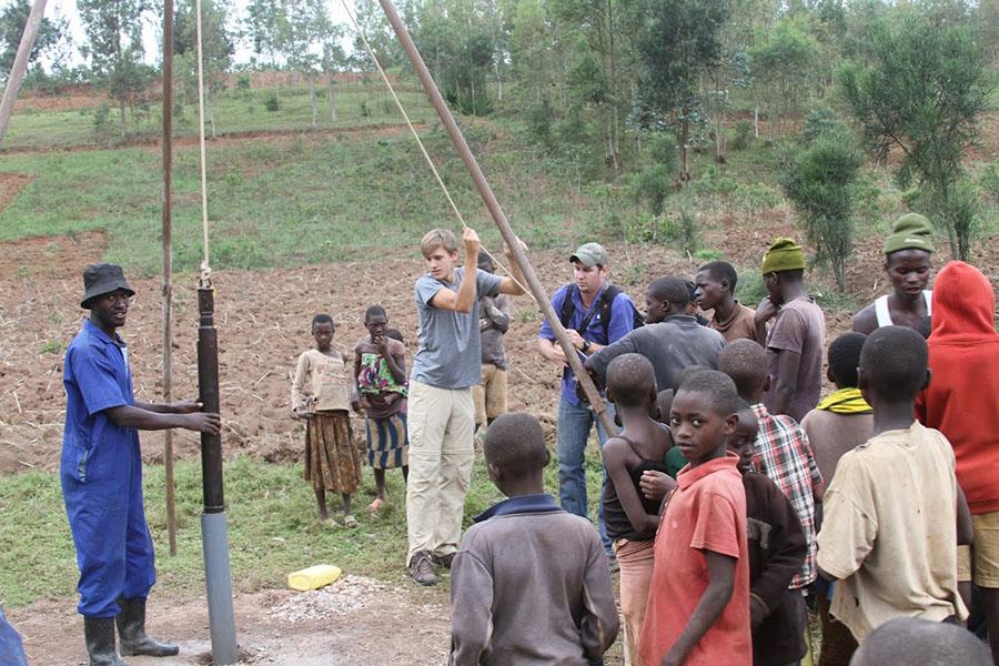 Greyson Witt drilling a well in Rwanda