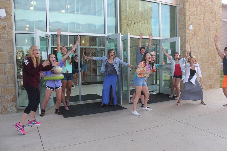 PALS show school spirit by greeting students at the front doors. 