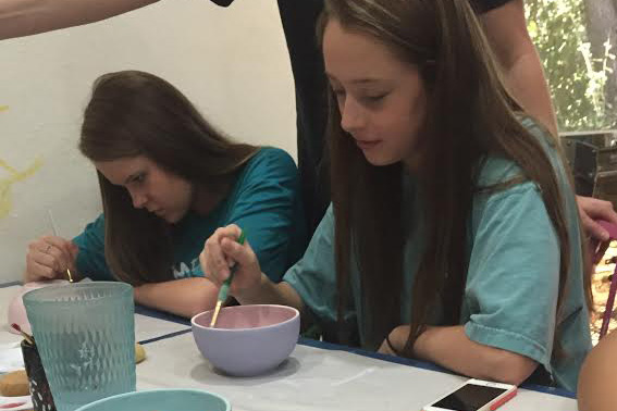 The volleyball teams painted bowls over the weekend at Ceramics Bayou that will later be auctioned off with the proceeds benefiting Austin homeless shelters.  