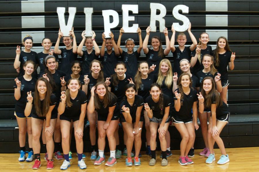 The lady viper Basketball team takes team pictures together before scrimmages.