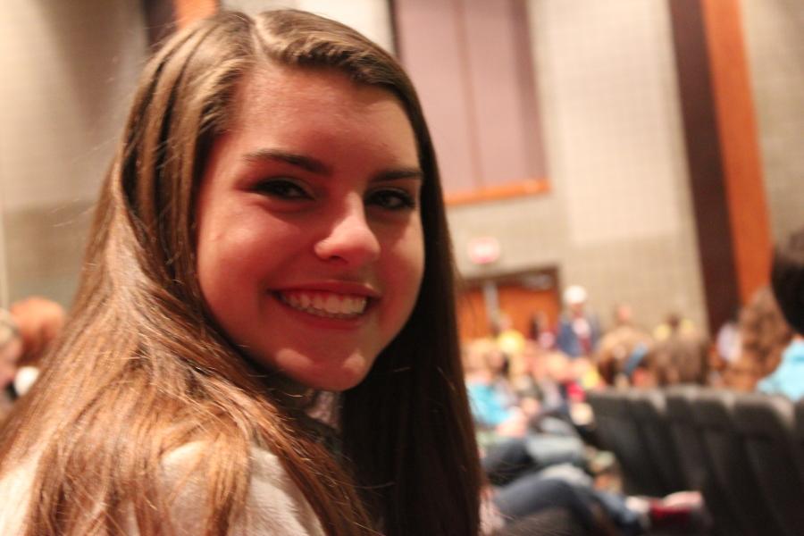 Freshman, Rachel Honts, is all smiles as she sits among 700 of Leander ISD's C2 students. 
