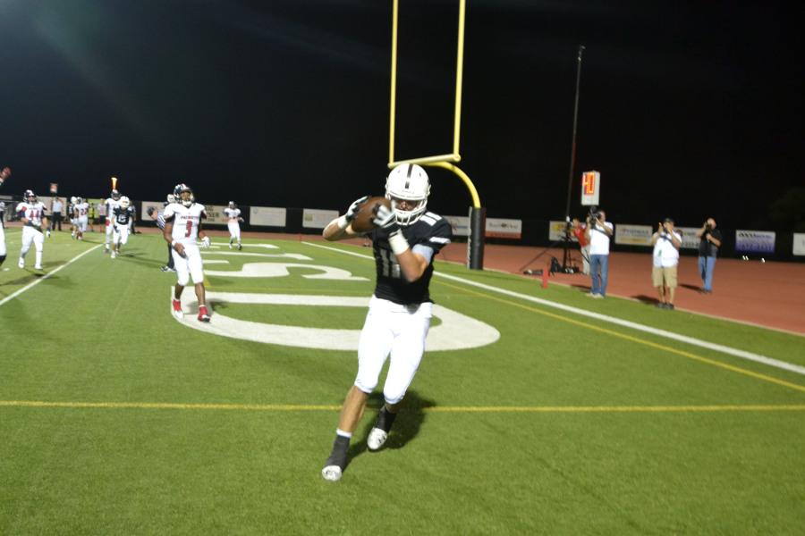 Senior wide receiver Bear Christianson catches his first touchdown of the game against East View. The final score was 52-51 and was the first loss of the season. 