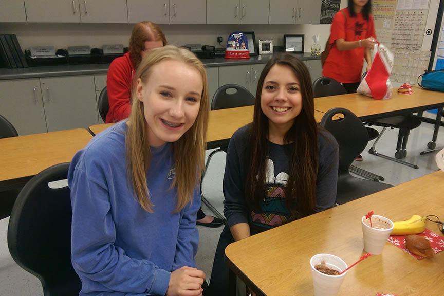 Juniors Kara Dubose and Kim Grounds pose for a picture at the FCCLA Christmas party.