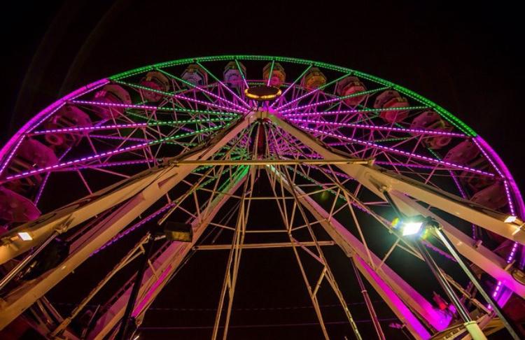 The trail of Lights adorns a Ferris wheel with colorful lights to celebrate its 50 year anniversary.