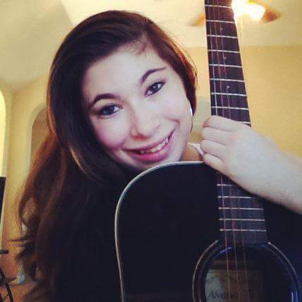 Junior Teghan Himelfarb posing with her beloved guitar.