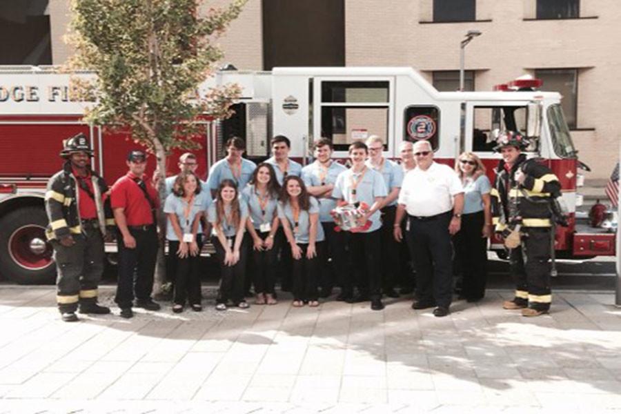 The Boston Fire Department visits the HCEF Inventeam during Eurekafest to view their product, The Dalmatian