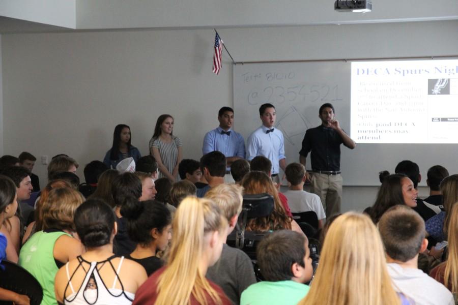 DECA officers inform members about competitive events.