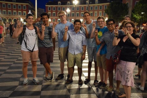 French students and Madame Simon holding up the Viper Strike hand signal in Nice, France.