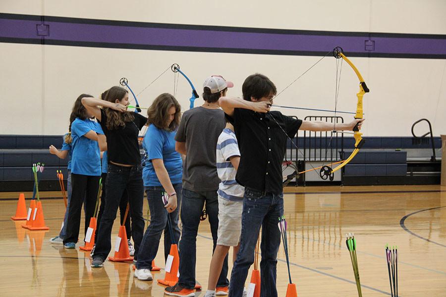 Archery+students+prepare+to+shoot+the+targets+at+the+competition+on+Oct.+24+at+Four+Points+Middle+School.+