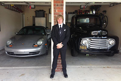 Senior Zach Greenquist with his fathers Porsche 911 Carrera 4 and his fixed up 1950 Ford F1.