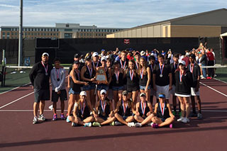 The tennis team poses with their second place trophy.