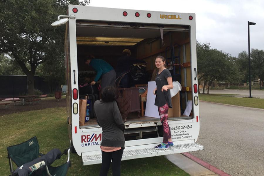 Sophomore+theatre+student+Madison+Woodrom+helps+load+the+truck+used+to+bring+the+donated+items+to+Savers.