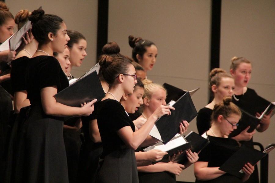 Senior Marisa Collmann sings with the choir at their Leander concert in October. 