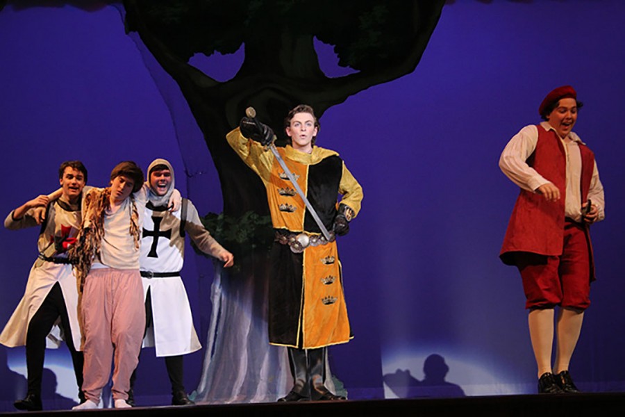 Sophomore Evan Welliver singing one of his songs in the musical: Cinderella.