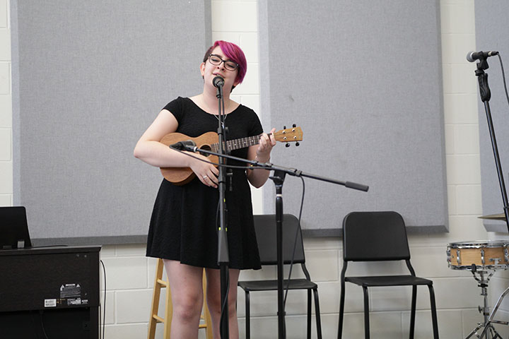 Junior Isabel Moring performs at Pop Unplugged.