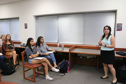 Admissions representative Daisy Pena from UT Dallas talks to students. The visit went on during PIT.