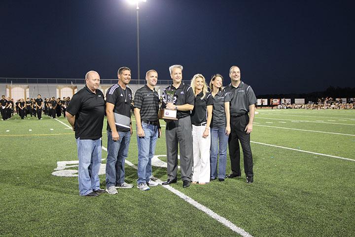 UIL representatives Brad Kent and Tracy Neely present the Lone Star Cup to Dan Troxell, Charlie Little, and Drew Sanders.