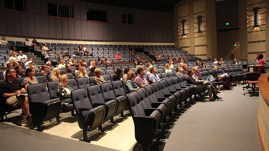 Parents sit and listen to counselor Peggy Morisset during Junior Parent Night.