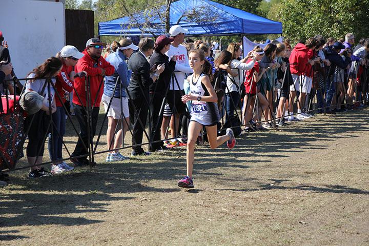 Freshman Allison Mopsik runs at the cross country UIL state meet.