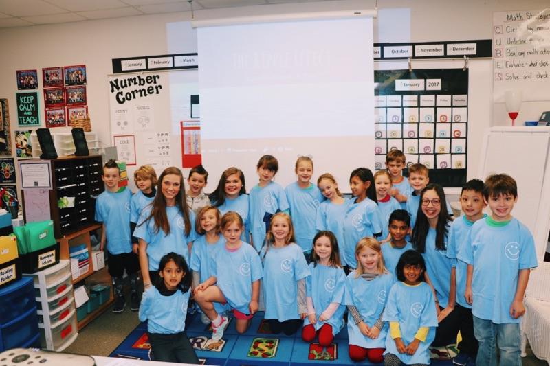 Sophomores Tate Watson, Camille Digiaimo and Brandi Killingsworth work with Kelly Killingsworths first grade class at Laura Bush Elementary to promote their FCCLA project. 