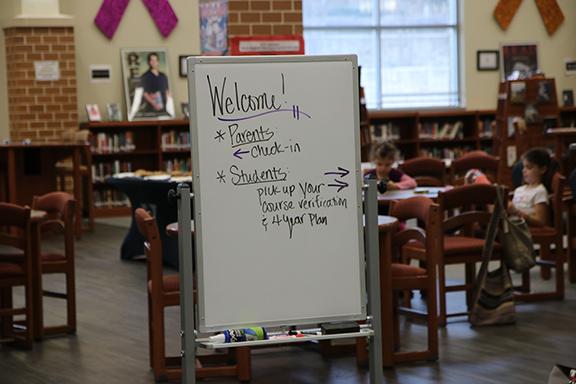 Freshmen meet with parents during student led conferences