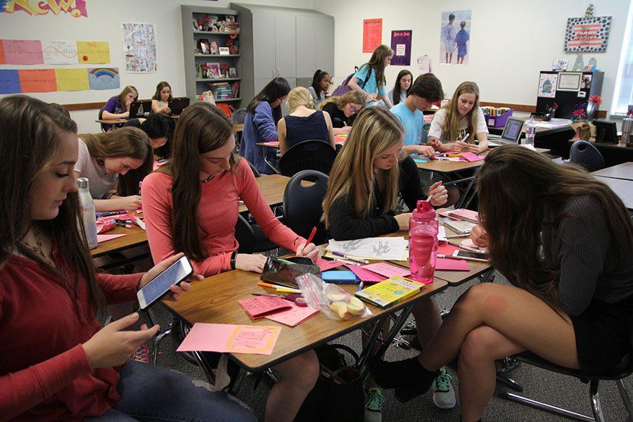 NHS members write Valentines cards. -Caitlin McKeand