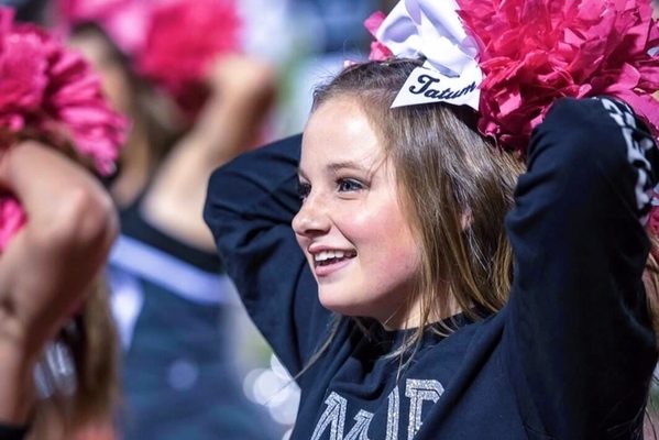 Tatum Apel, a future member of the white squad at UT, cheers for Vandegrift