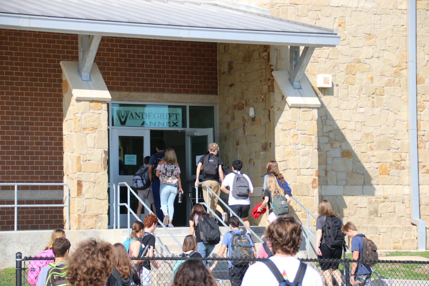 Students walk from Vandegrift to Four Points for their next class