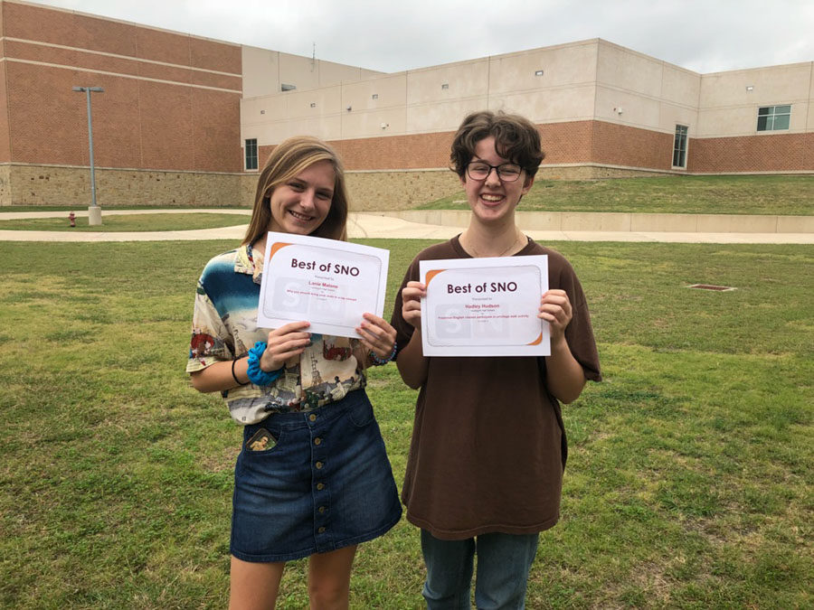 Alaina Malone and Hadley Hudson holding up their Best of SNO awards.