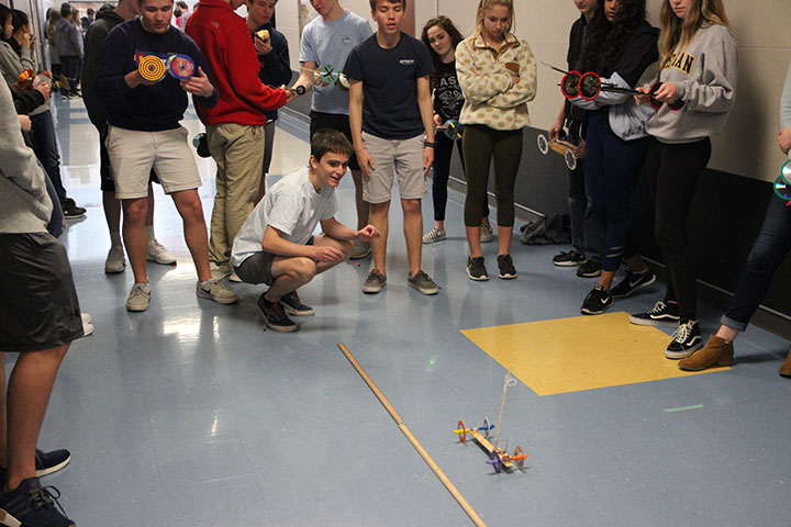Junior Ryan Morreale engages his mousetrap car.