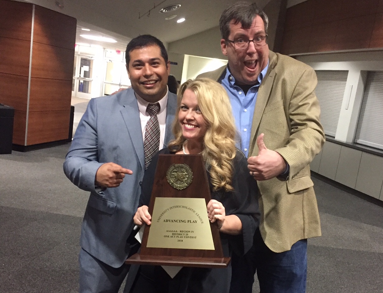 Directors Celeste Schneider (middle), John Alonso (left) and John Conner (right) pose with the advancing play trophy.