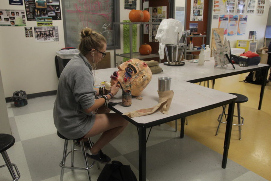 Junior Mia Rice makes her paper mache head in Ceramics. 