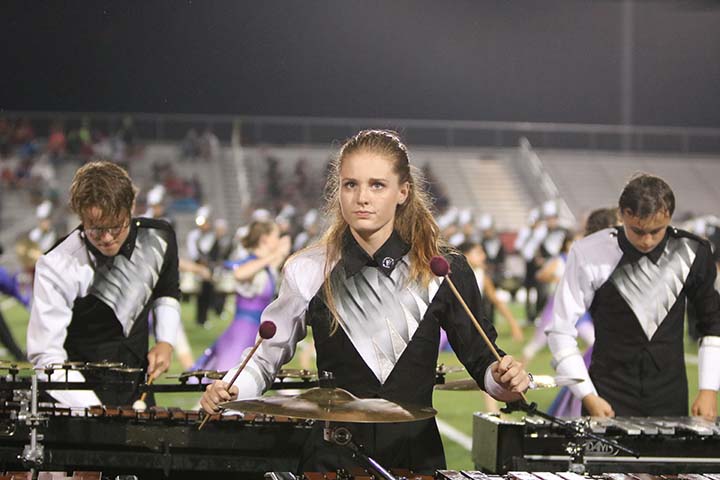 Senior Jordan Apra plays the marimba during halftime