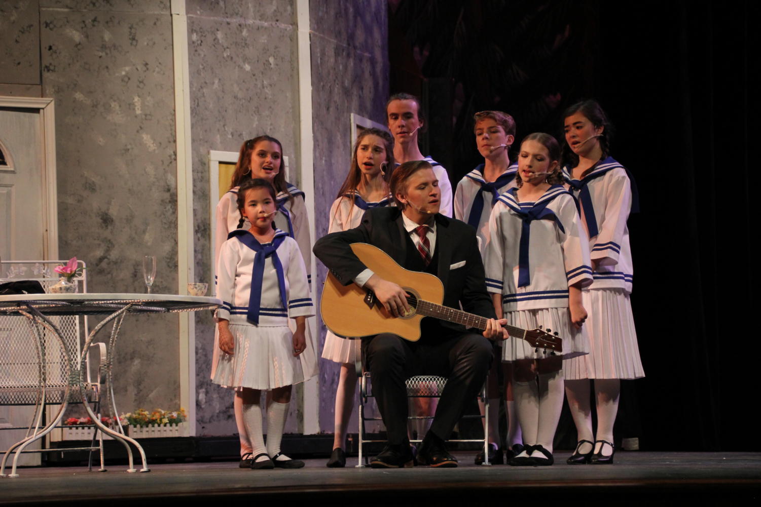 John Paul Kinney and his fellow actors sing