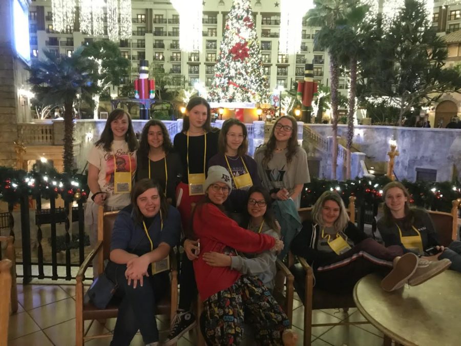 Students posing for a picture upon arrival at the Gaylord.