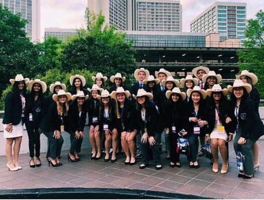 DECA students pose outside of hotel at ICDC competition in Atlanta.