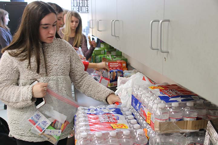 FCCLA member Charlotte Saggers fills a Blessing Bag during the clubs Thanksgiving party Nov. 14. 