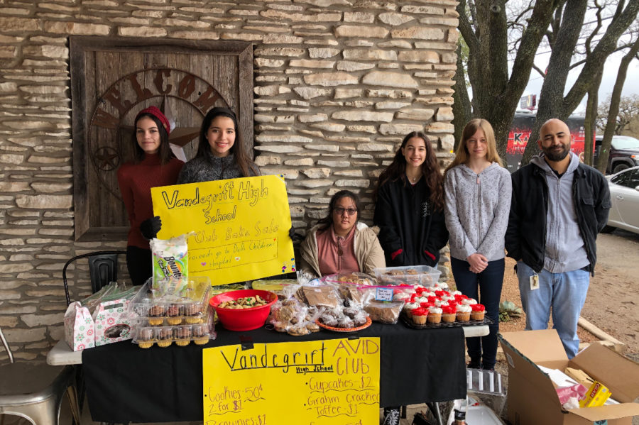 Members advertise bake sale posters 