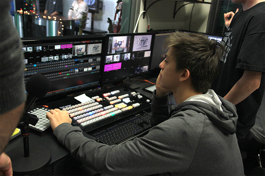 Senior Jasper Tripoli watches the tricaster.