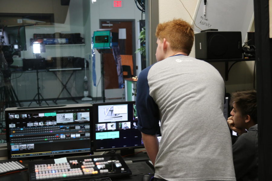 Junior Coltyn Present helps operate the computer.