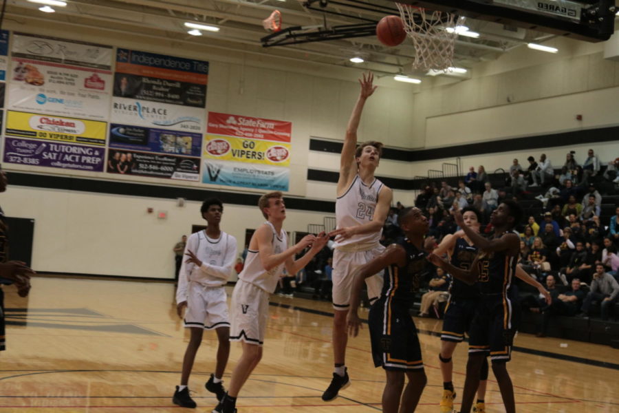 Gabe Reyer drives to the basket and floats the ball in against Stony Point on Feb. 12.