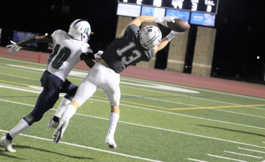 Trey Mongauzy reaches to catch the ball during a home game.