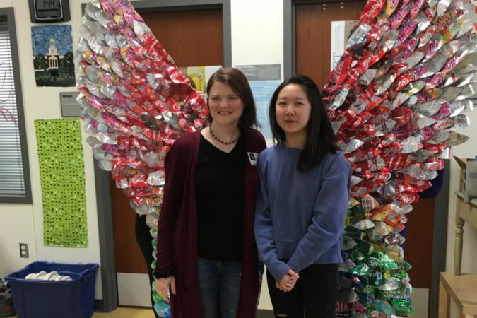 Emily Huang and Ashli Williamson posing in front of Ariel before the Leander Public Arts Commission takes them for their new park