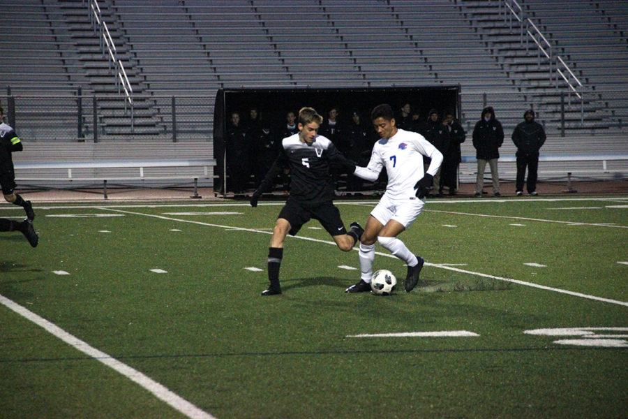 Quin Collins attempts to tackle a Leander High School player