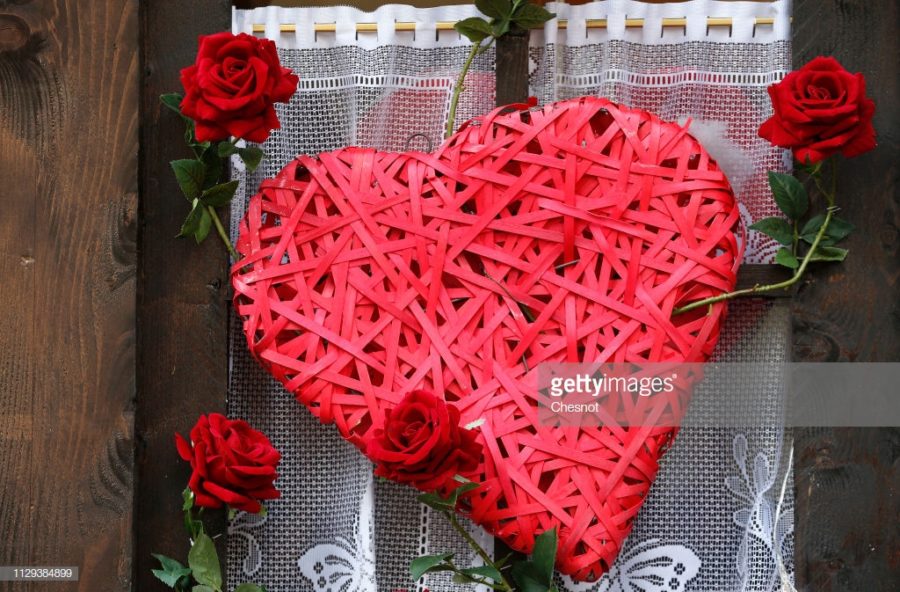 PARIS%2C+FRANCE+-+FEBRUARY+13%3A+A+red+heart++and+red+roses+are+displayed+in+the+window+of+a+restaurant+on+the+eve+of+the+Valentine%27s+Day+on+February+13%2C+2019+in+Paris%2C+France.+Valentine%27s+Day+is+a+celebration+of+love+and+romance+for+many+people+across+the+world.+%28Photo+by+Chesnot%2FGetty+Images%29