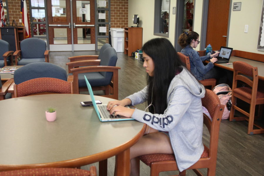 Junior Kaylee Marquez completes homework in the library during her free time. “I work in the library because I don’t want to do work over the weekend, Marquez said.