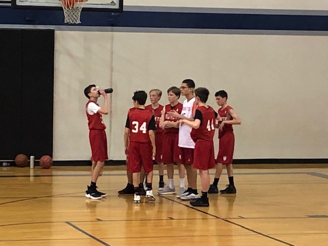 During a timeout, Justin talks to the team about the teams game plan. 

Photo Creds: Justins Mom